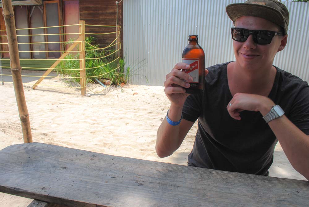 drinking Red Stripe in Negril Jamaica