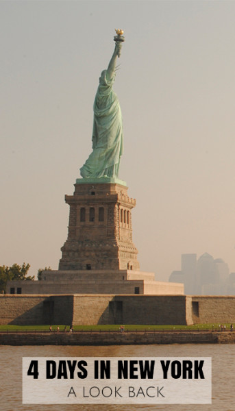Statue of Liberty looking across a hazy New York Bay towards Manhattan