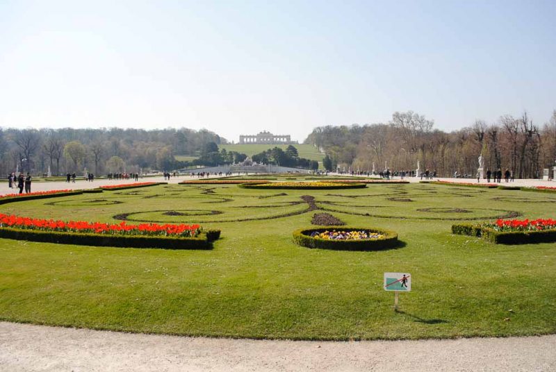 Schonnbrunn Palace Gardens with Neoclassical arcade in the distance