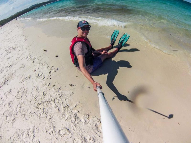 Sitting on Whitehaven Beach Whitsundays QLD