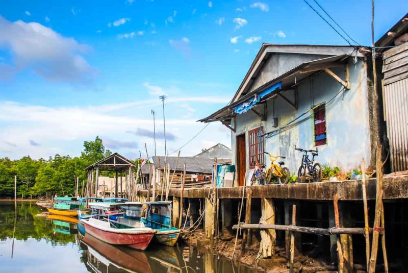 Boats and houses on stilts in Senggarang Village Bintan, Indonesia