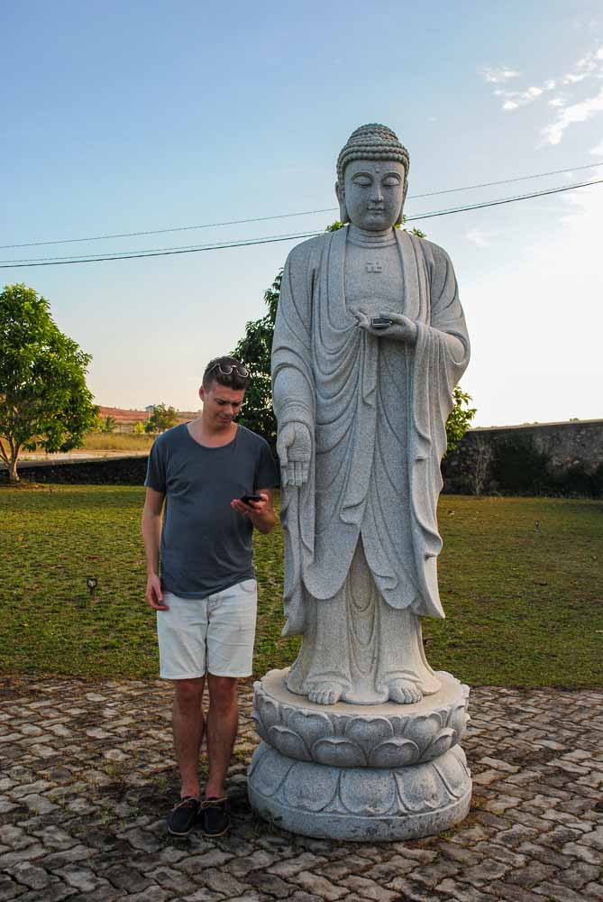 Checking our phones at Vihara Avalokitesvara Buddhist temple