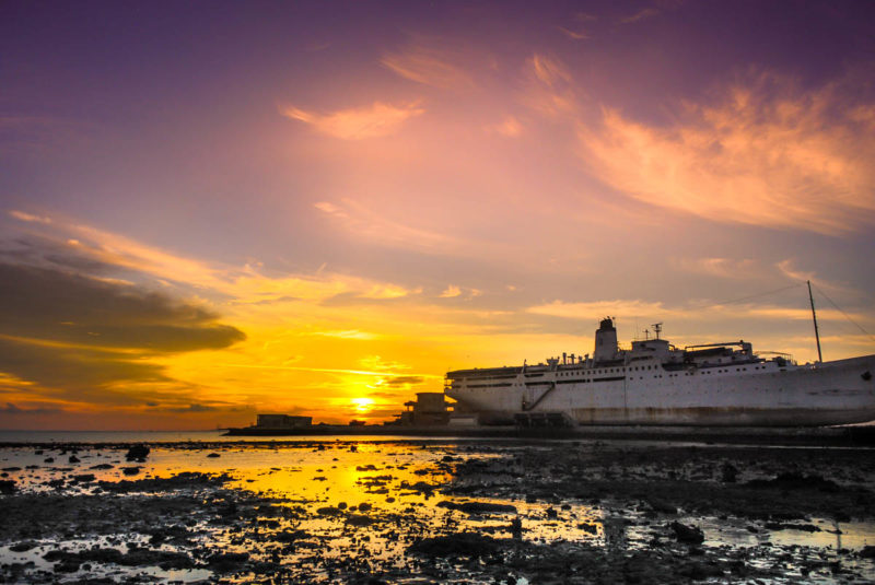 Sunset in Bintan Island with a grounded ship