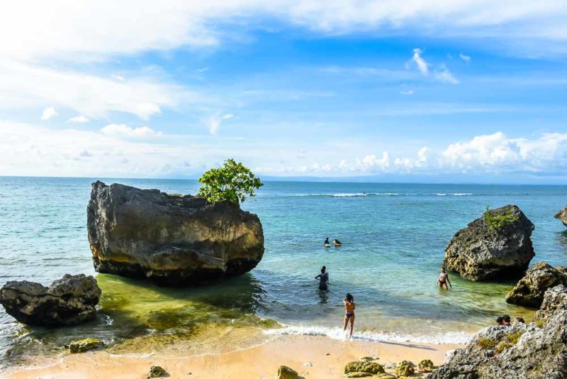 Rocks slightly away from the crowd at Padang Padang Beach