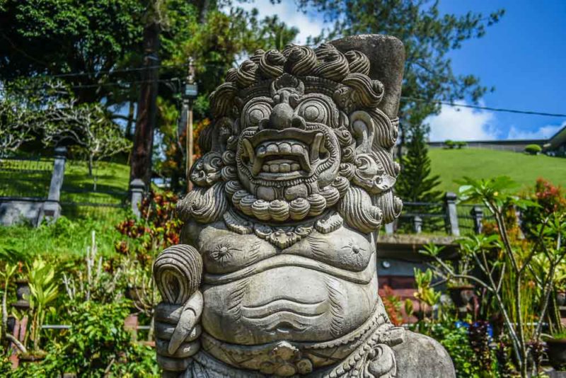 Monster statue at Pura Tirta Empul Holy Spring Water temple Ubud