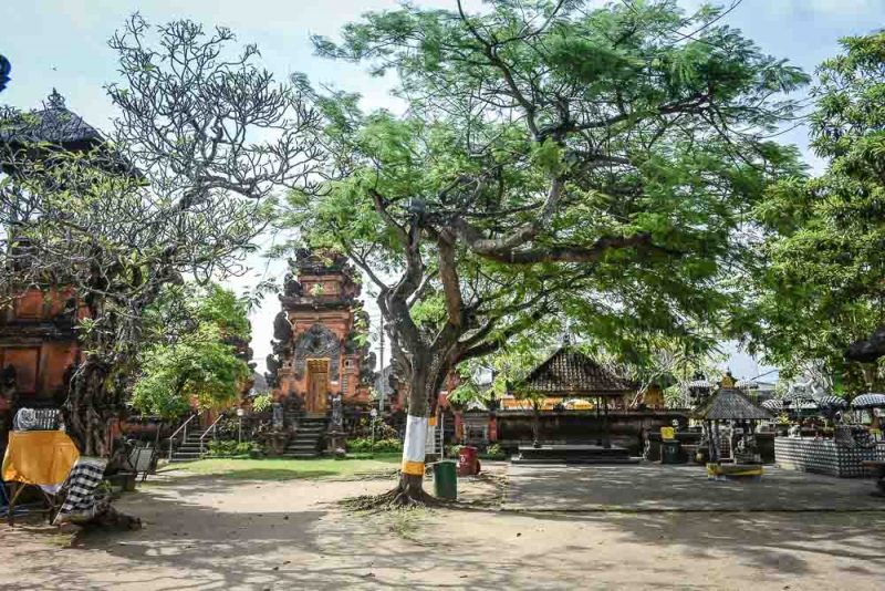 Trees and shrines in the Petitenget Temple in Seminyak Bali