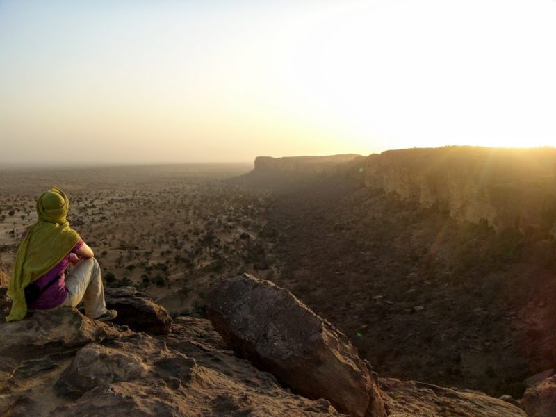 Thea watching the sunset from the top of the Bandiagara escarpment