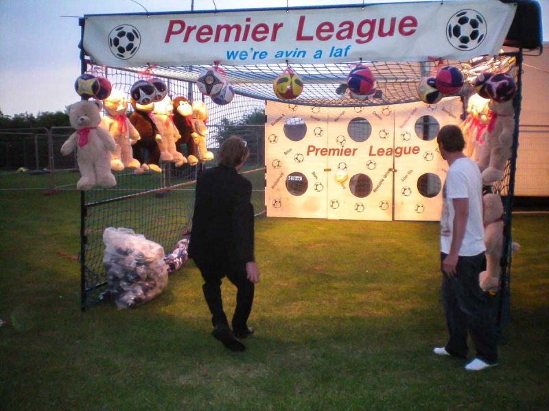 Taking football shots in a suit jacket and leather shoes at Leeds Summerball 2010