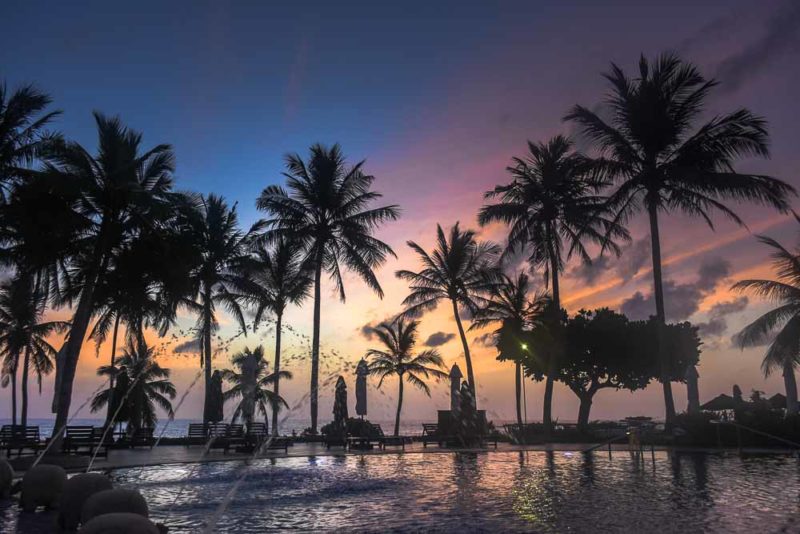 Sunset over the Taj Bentota Hotel and Spa Swimming Pool