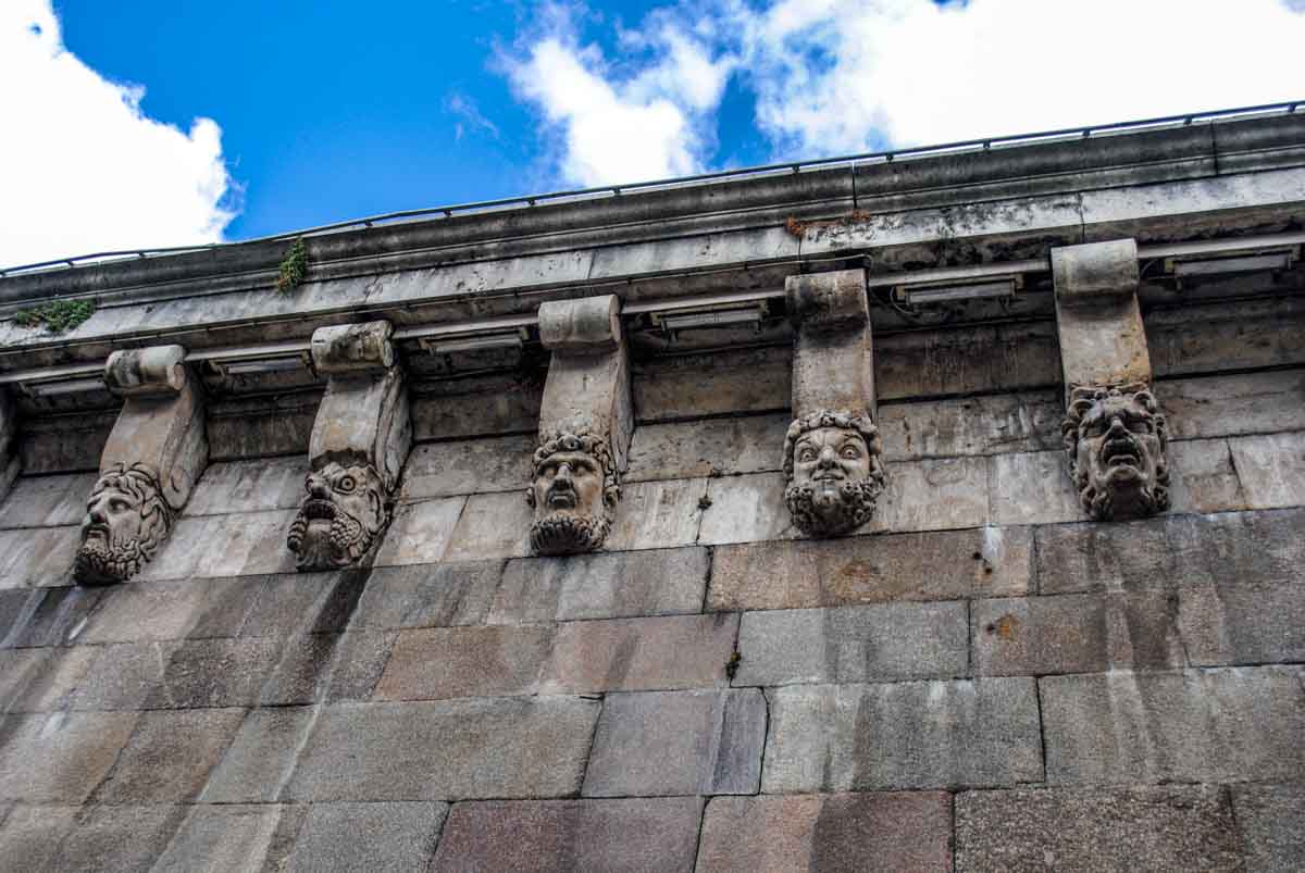 Grotesque heads on Pont Neuf Paris