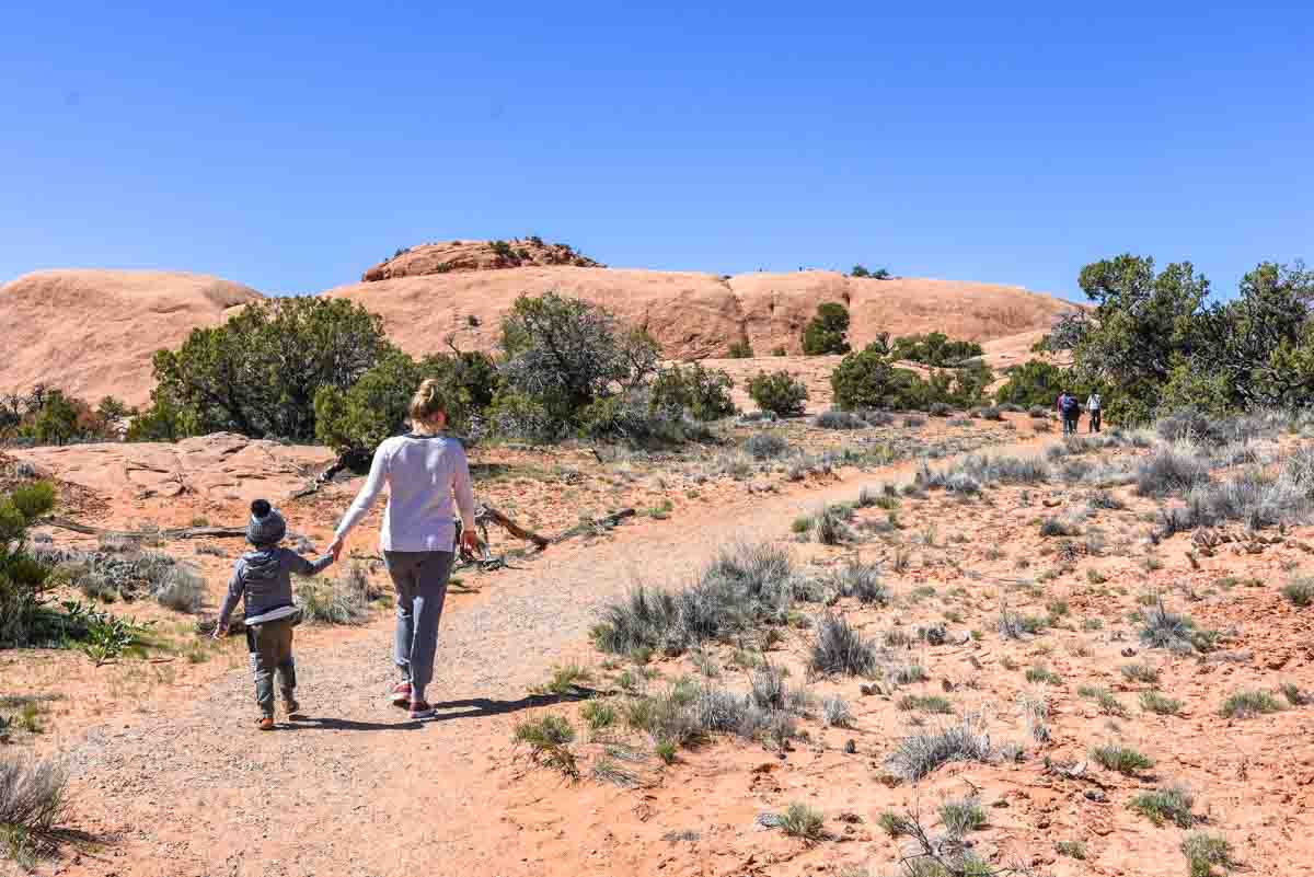 Walking towards Whale Rock in Canyonlands Island in the Sky